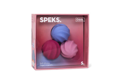 Speks Odds S set of three soft silicone fidget magnets in blue, magenta, and pink, shown in their pink retail packaging box against a white background.