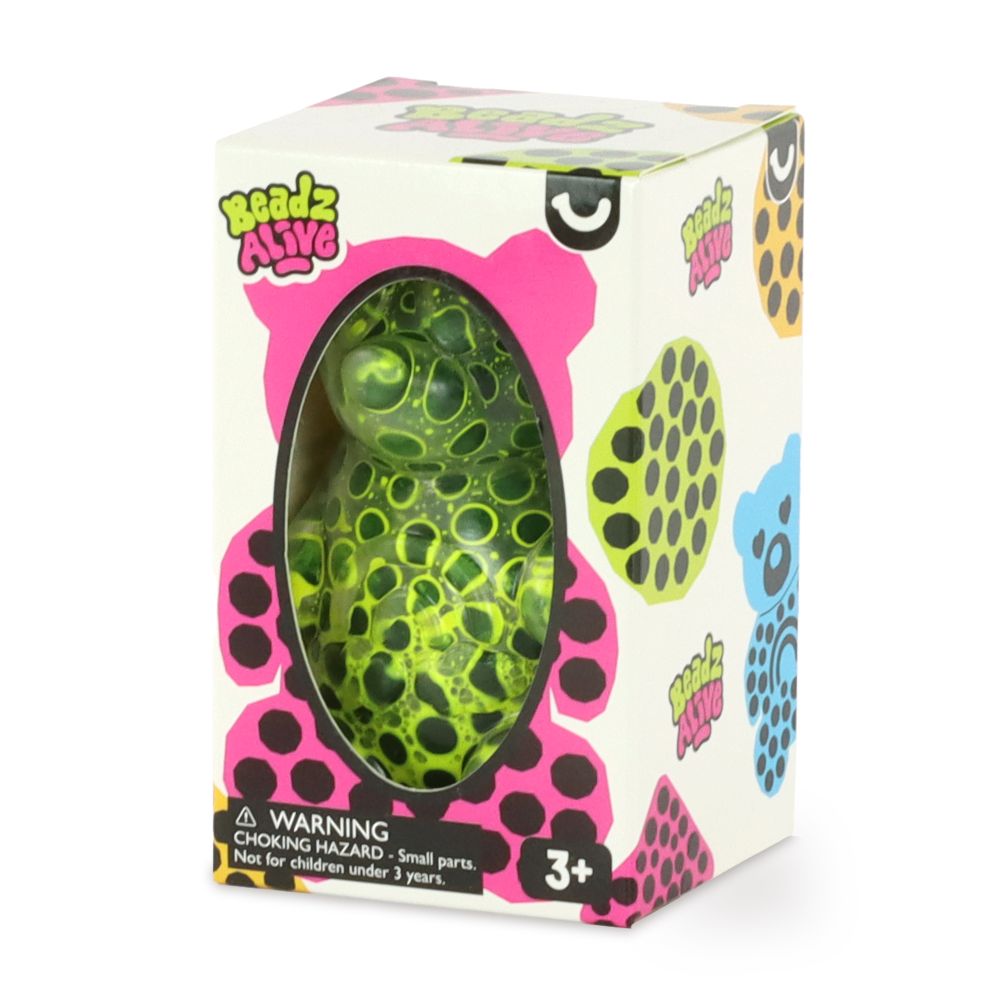 A green bear-shaped sensory toy packaged in a box with colorful designs, labeled for ages 3+.