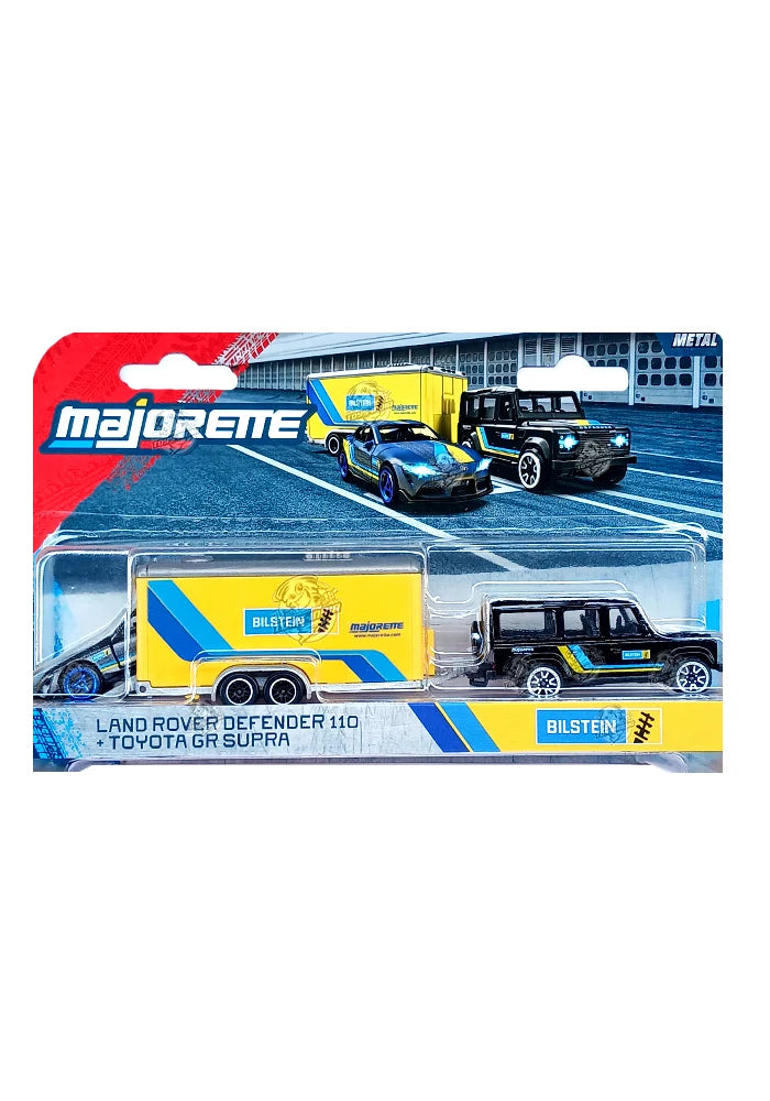 Majoreme brand toy set featuring a Land Rover Defender 110 and a Toyota GR Supra die-cast model cars with a yellow and blue trailer, presented in its original blister card packaging.