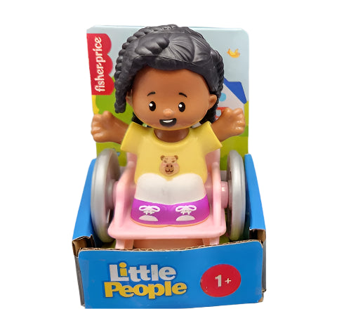 A Fisher Price Little People figure set featuring a girl in a wheelchair. The toy is multicolored, with the primary colors being pink and yellow, and includes packaging with the Little People logo.