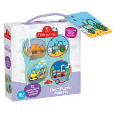 A children's toy set in a clear plastic carrying case with a purple handle and purple base. The front shows colorful round puzzle images and text including 'That's not my.