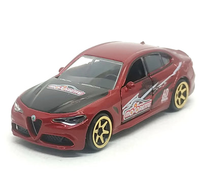 A red and black die-cast model car with gold wheels, featuring 'MotoCriste' decals, photographed on a white background.
